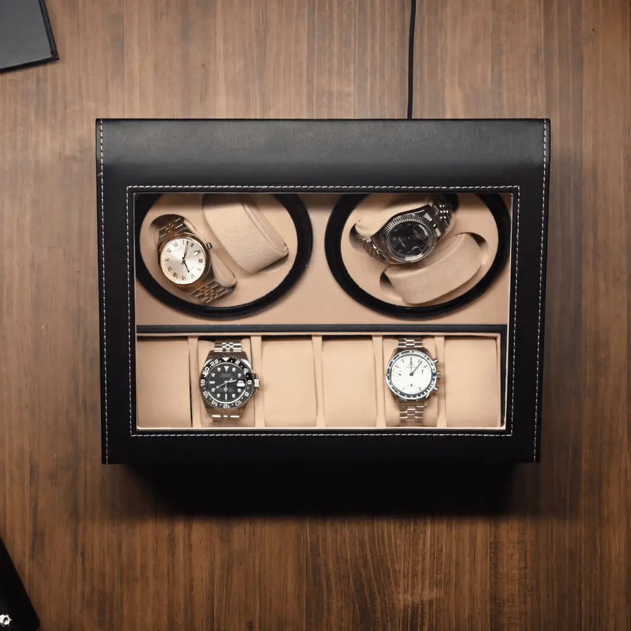 Kensington black watch winder box open on a walnut surface with watches in place