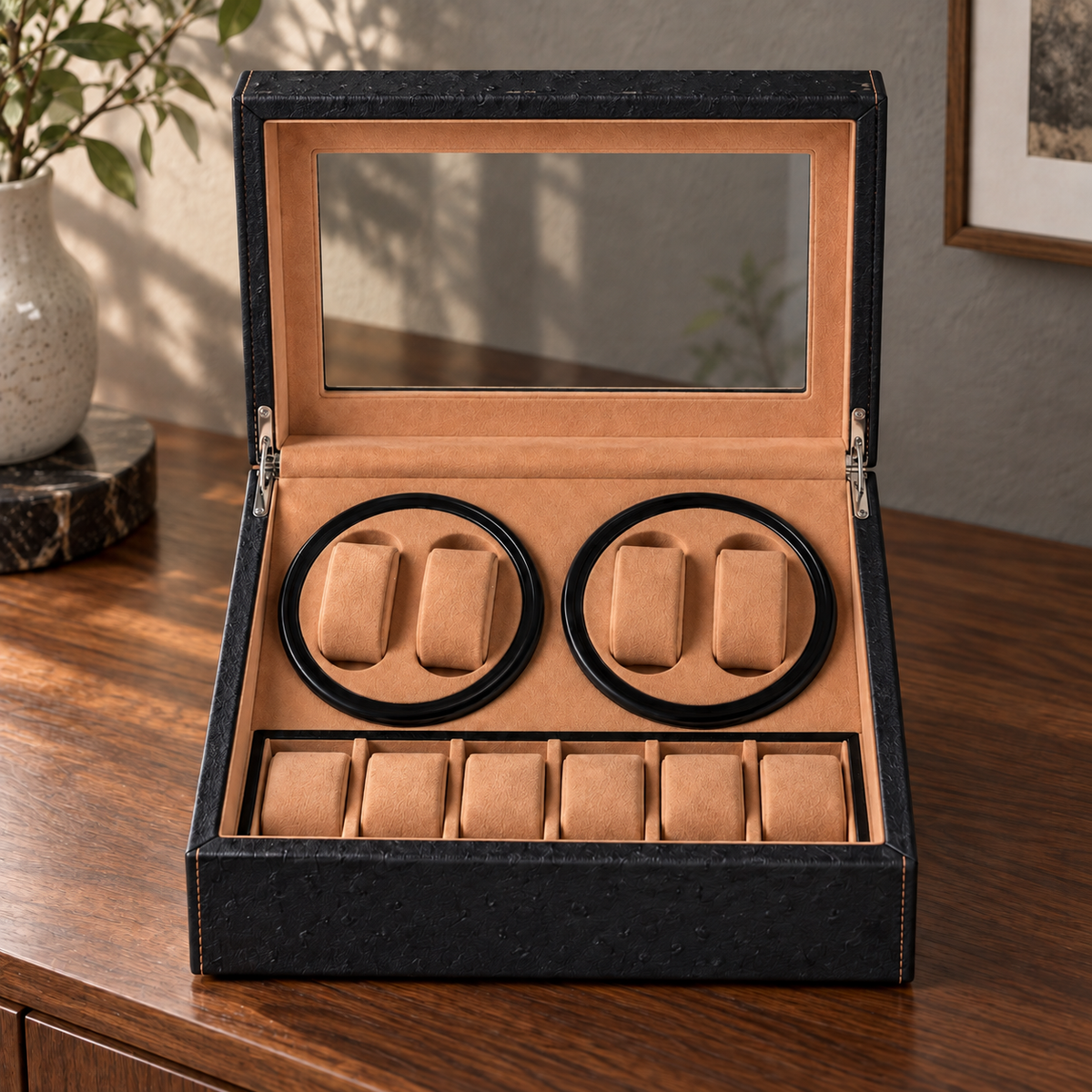 Boîte remontoir Trocadéro noire et cognac, ouverte de face, avec ses compartiments de remontage et de rangement.