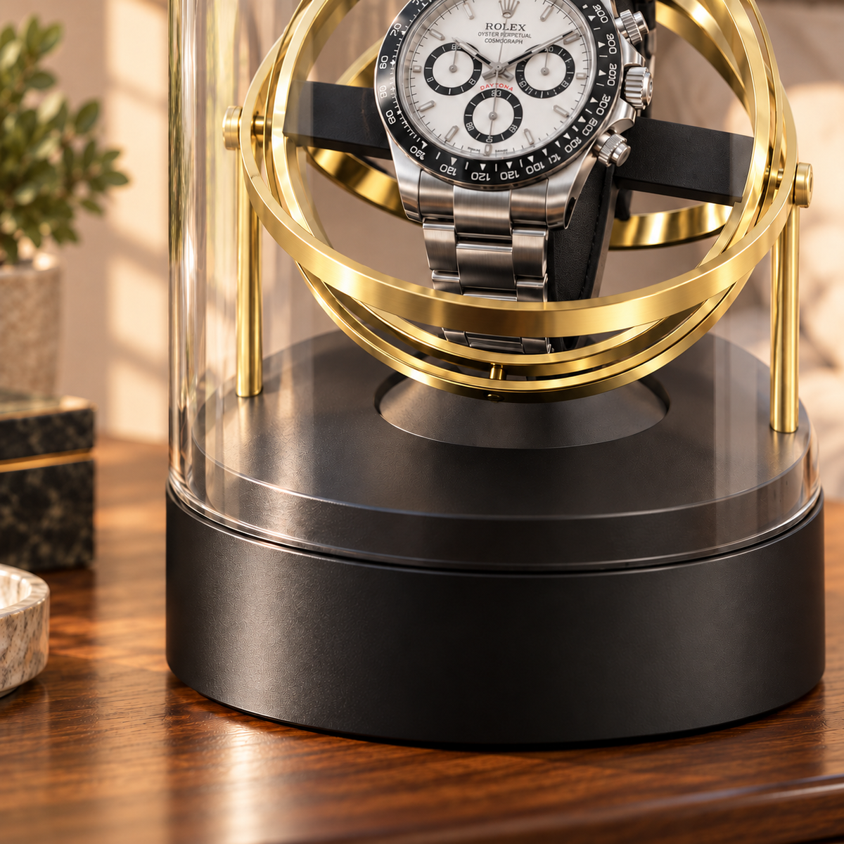 Axis gold-tone gyroscopic single watch winder — cloche, lifestyle product view.