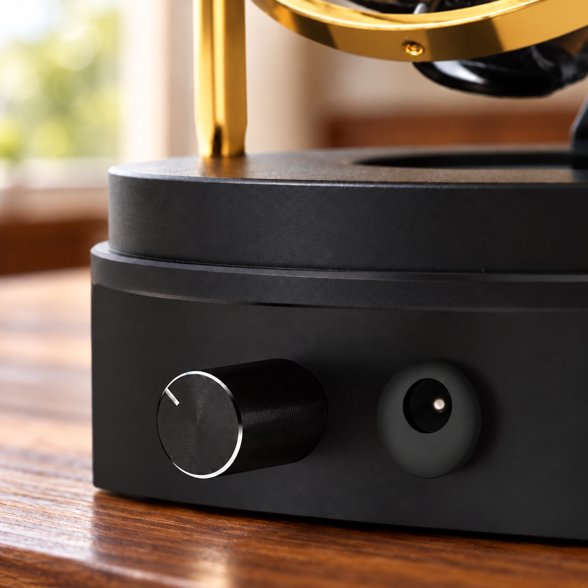 Axis gold-tone gyroscopic single watch winder — commandes, lifestyle product view.