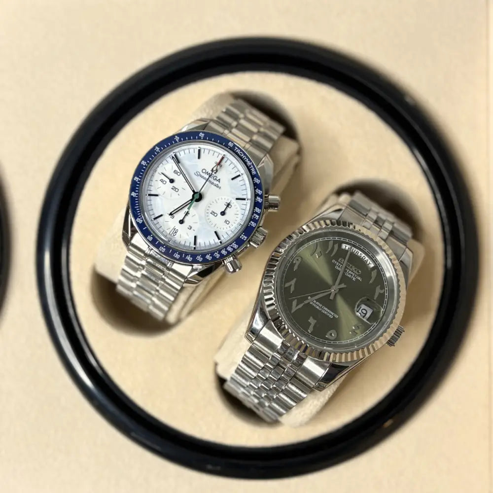 Close-up of two automatic watches resting on the Kensington winder cups
