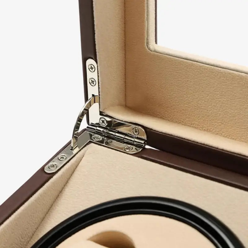 Close-up of the lid hinge and beige lining of the brown Kensington